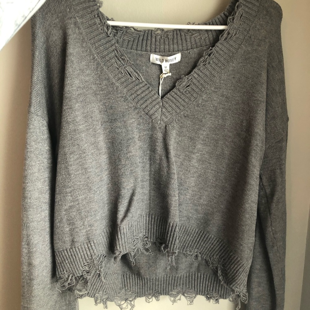 Cropped distressed sweater
